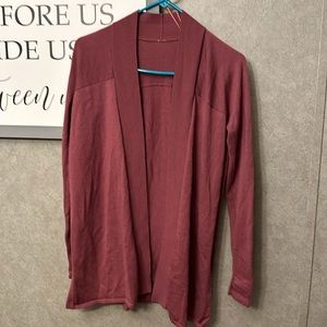 Beautiful Lululemon Cardigan with metal logo. Size 6. Brand New Condition.